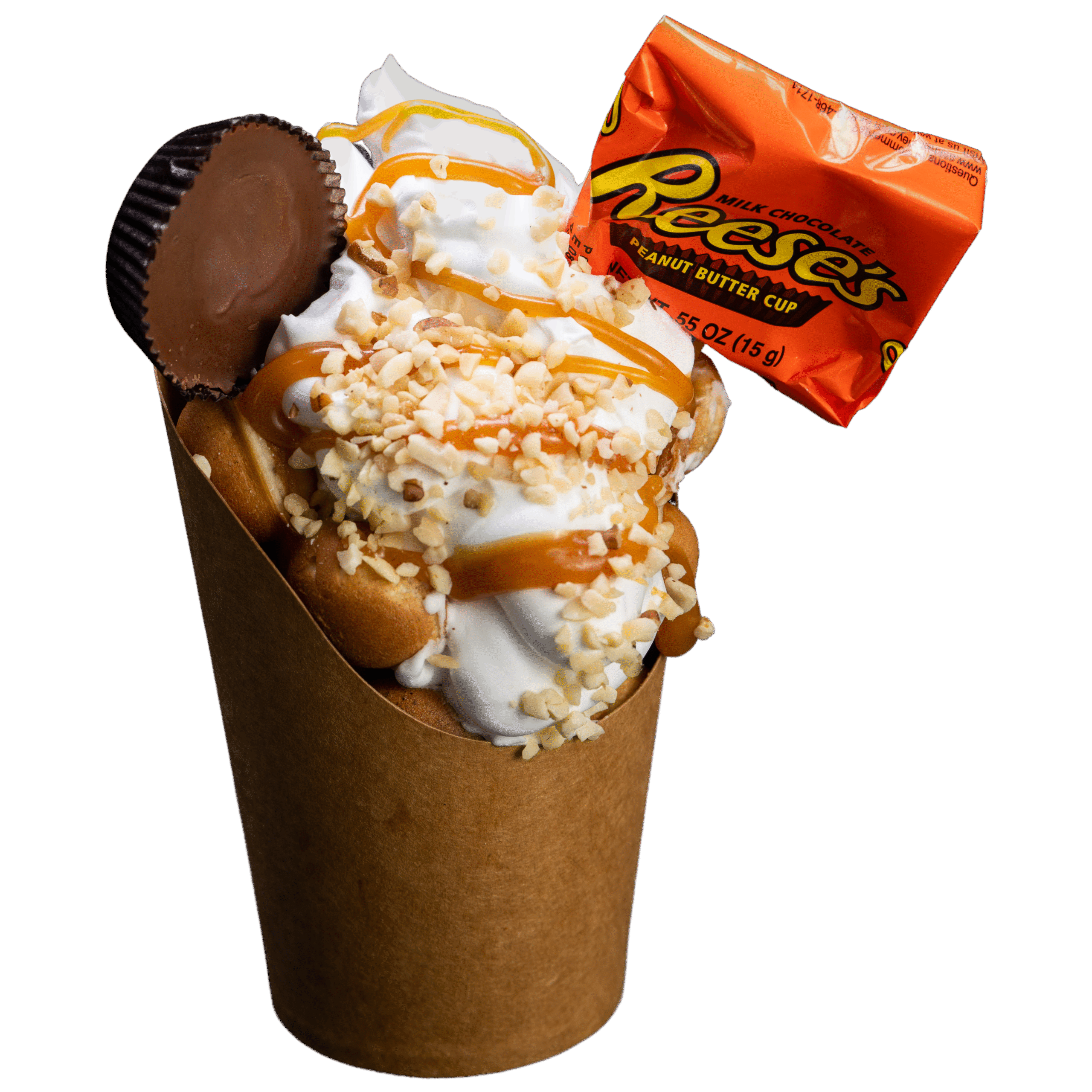 Bubble waffle with whipped cream, crushed nuts, caramel drizzle, and Reese's peanut butter cup and wrapper.